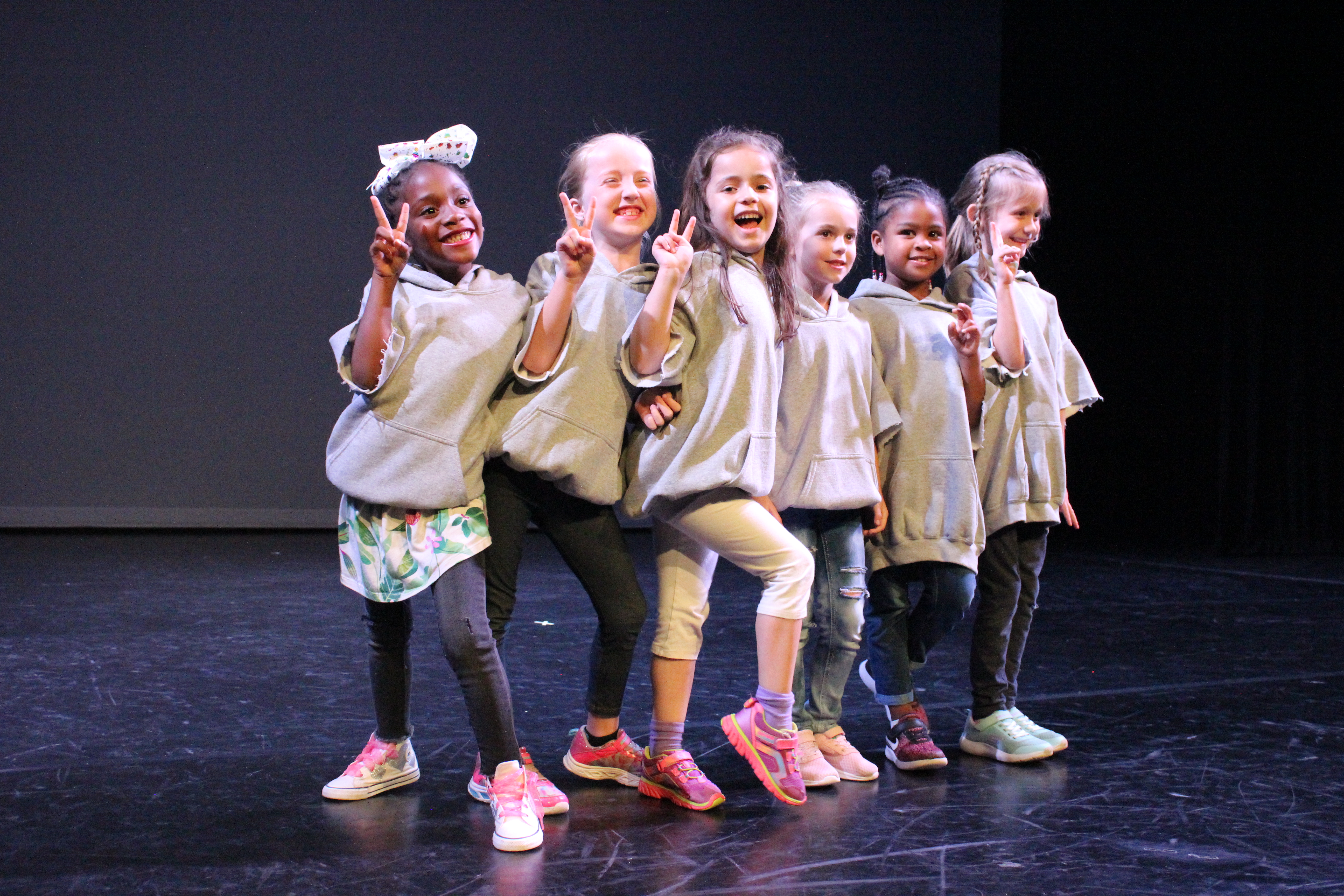 image depicting a group of young students on the stage