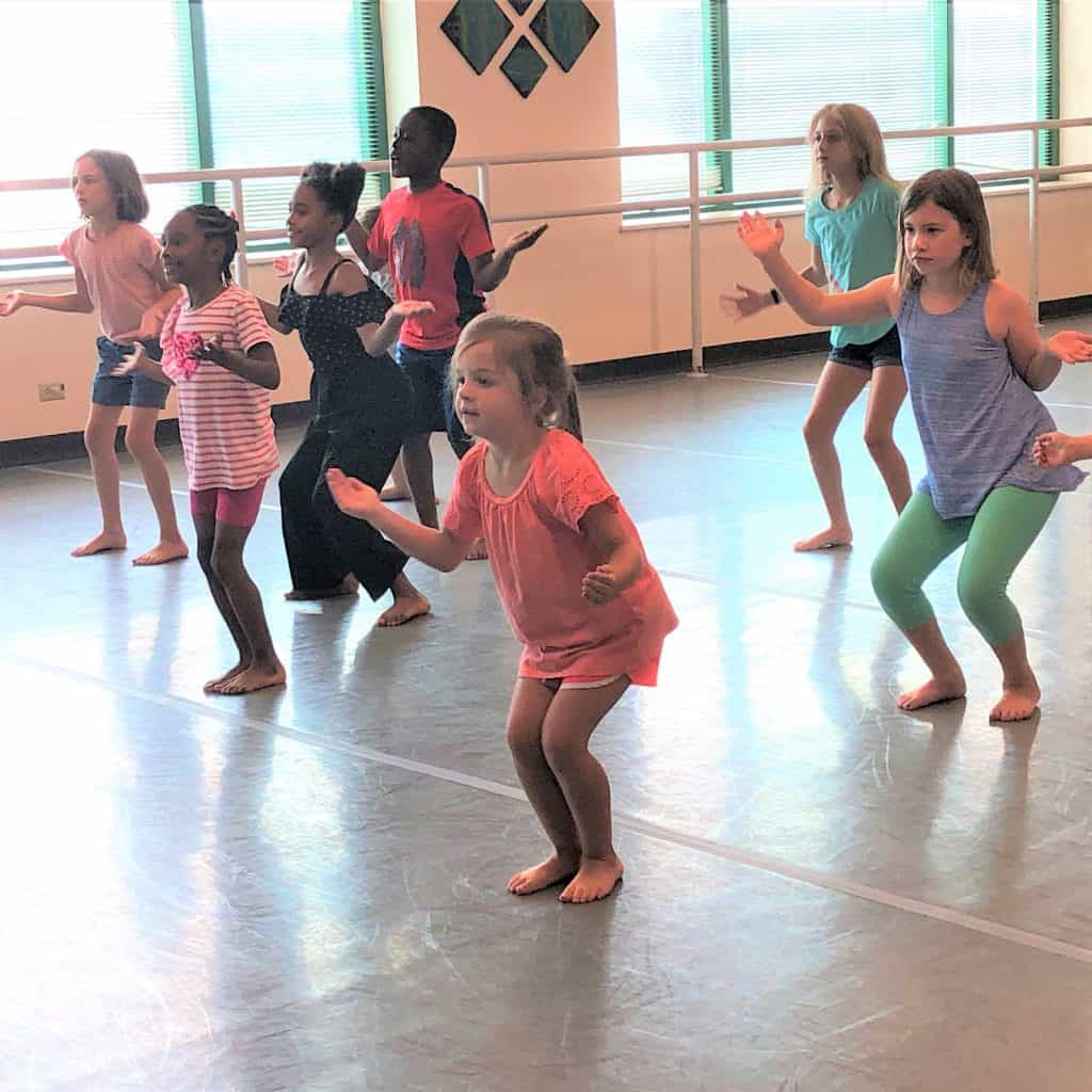 Children dancing in a dance studio.