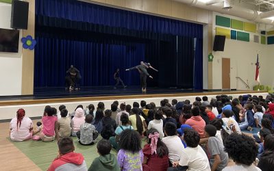 A school performance on Peck Elementary's stage features performers from Black Box Dance theater.